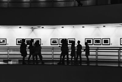 Men standing in corridor