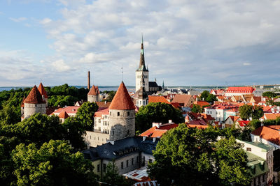 Buildings in city against sky