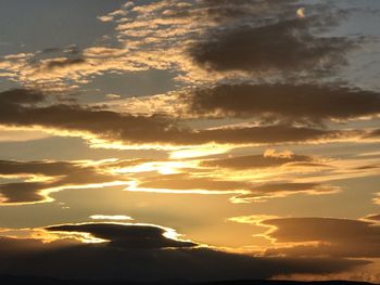 Low angle view of dramatic sky during sunset