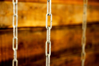 Close-up of icicles against wall