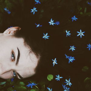 High angle view portrait of woman with flowers in hair