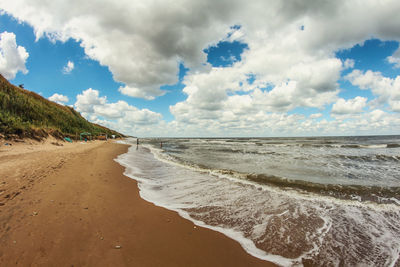 Scenic view of beach against sky