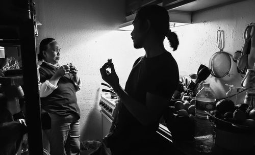 People standing in kitchen