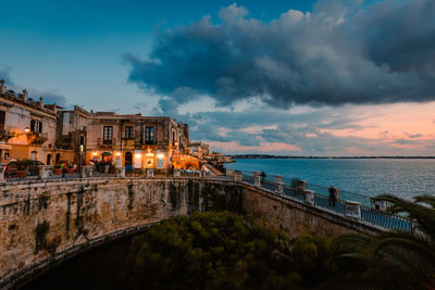 Panoramic view of ortigia with fonte aretusa and lungomare alfeo  during sunset