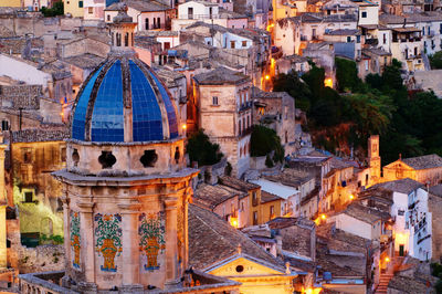 High angle view of illuminated buildings in city