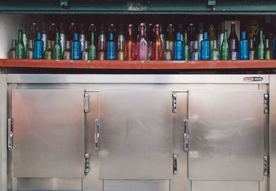 Close-up of bottles in shelf