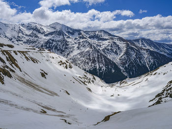 Scenic view of snowcapped mountains against sky