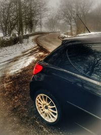 Car on snow covered road