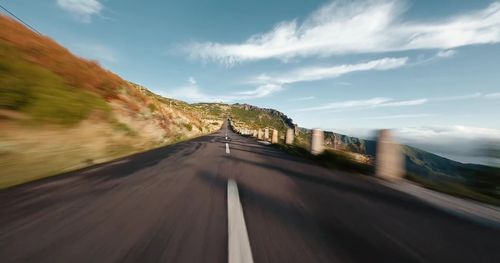 Blurred motion of road against sky