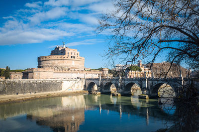 Ponte sant angelo by hadrian tomb against sky