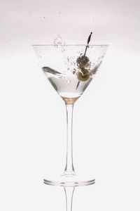 Close-up of wine against white background