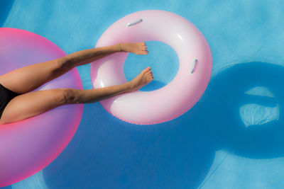 Low section of woman in swimming pool