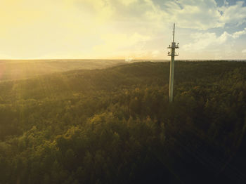 Scenic view of land against sky during sunset