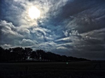 Scenic view of landscape against cloudy sky