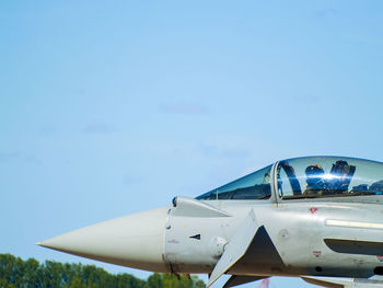 Close-up of airplane against sky