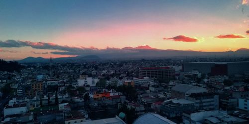 High angle view of townscape against sky during sunset