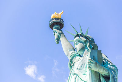 Low angle view of statue against sky