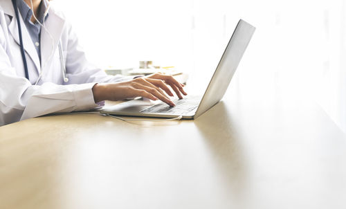 Man using laptop on table