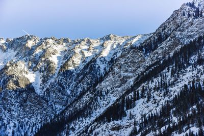Scenic view of snowcapped mountains against clear sky