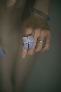 Cropped hand of woman holding heart shape