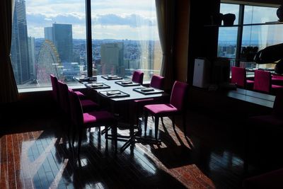 Empty chairs and tables in restaurant