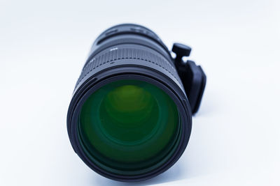 Close-up of camera lens on white background