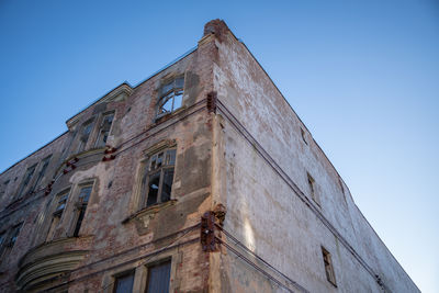 Low angle view of building against clear blue sky