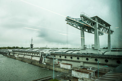 View of bridge over river against sky