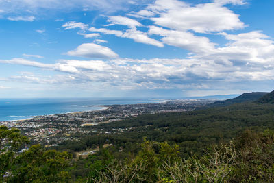 Scenic view of sea and mountains against sky