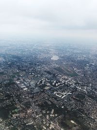 Aerial view of city and buildings against sky