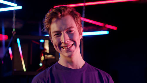 Portrait of smiling man in internet cafe