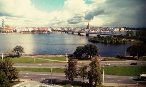 Bridge over river with city in background