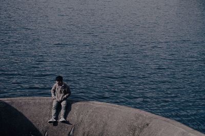High angle view of woman standing in sea
