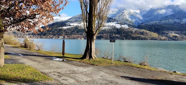 Scenic view of lake and mountains against sky