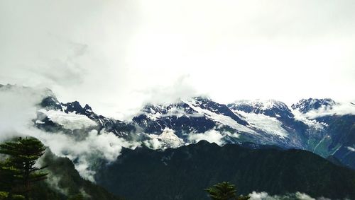 Scenic view of snow mountains against sky