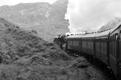 Train on railroad track against sky