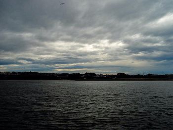 Scenic view of sea against cloudy sky