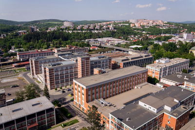 High angle view of buildings in city against sky