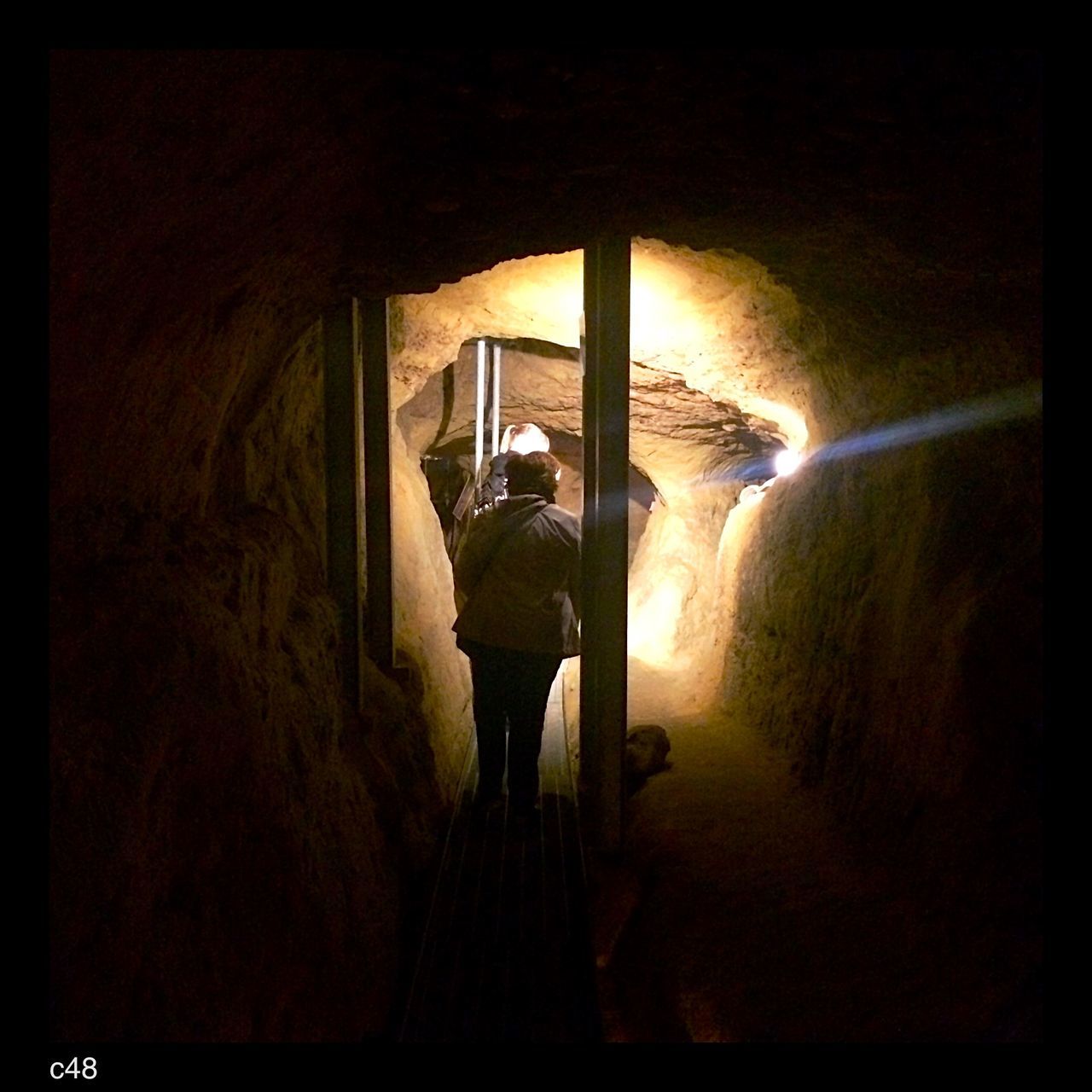 architecture, indoors, built structure, one person, direction, the way forward, rear view, men, real people, standing, full length, lifestyles, staircase, building, day, tunnel, leisure activity, auto post production filter, unrecognizable person, dark