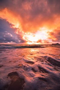 Scenic view of sea against dramatic sky