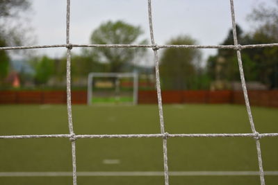 View of soccer field against cloudy sky