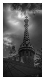 Low angle view of historical building against cloudy sky