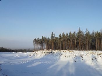 Scenic view of snowcapped landscape against clear sky