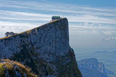 Rock formations on mountain against sky