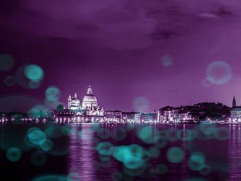 Illuminated buildings at waterfront