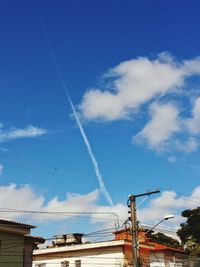 Low angle view of built structure against blue sky