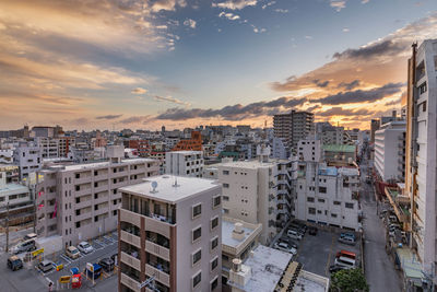 High angle view of buildings against sky during sunset