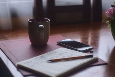 Close-up of coffee cup on table