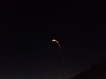 Low angle view of moon against sky at night