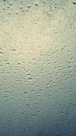 Full frame shot of wet glass window
